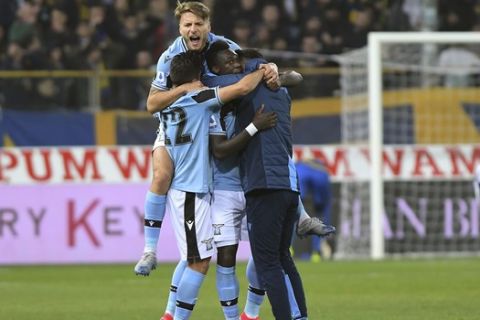 Lazio's Felipe Caicedo, center, celebrates with Ciro Immobile, top, and other teammates after scoring his side's first goal during the Italian Serie A soccer match between Parma and Lazio at the Tardini stadium in Parma, Italy, Sunday, Feb. 9, 2020 (Claudio Grassi/LaPresse via AP)