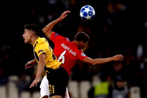 Benfica's Ruben Dias, right, jumps for hight ball next to AEK's Ezequiel Ponce during a Group E Champions League soccer match between AEK Athens and Benfica at the Olympic Stadium in Athens, Tuesday, Oct. 2, 2018. (AP Photo/Thanassis Stavrakis)