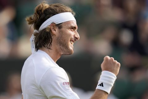 Stefanos Tsitsipas of Greece celebrates as he beats Serbia's Laslo Djere in a men's singles match on day six of the Wimbledon tennis championships in London, Saturday, July 8, 2023. (AP Photo/Kirsty Wigglesworth)