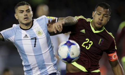 Argentina's Mauro Icardi, left, battles for the ball with Venezuela's Salomon Rondon during a 2018 World Cup qualifying soccer match in Buenos Aires, Argentina, Tuesday, Sept. 5, 2017. (AP Photo/Victor R. Caivano)
