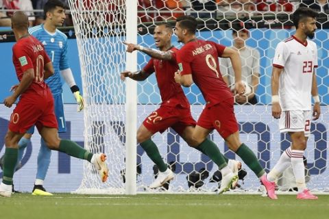 Portugal's Ricardo Quaresma, third right celebrates after scoring the opening goal of the game during the group B match between Iran and Portugal at the 2018 soccer World Cup at the Mordovia Arena in Saransk, Russia, Monday, June 25, 2018. (AP Photo/Francisco Seco)