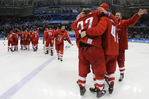 Olympic athletes from Russia celebrate after winning the men's gold medal hockey game against Germany, 4-3, in overtime at the 2018 Winter Olympics, Sunday, Feb. 25, 2018, in Gangneung, South Korea. (AP Photo/Julio Cortez)