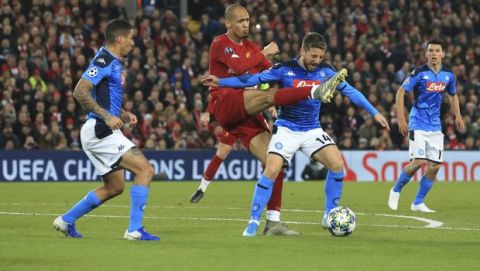 Liverpool's Fabinho, second left, competes for the ball with Napoli's Dries Mertens, third left, during the Champions League Group E soccer match between Liverpool and Napoli at Anfield stadium in Liverpool, England, Wednesday, Nov. 27, 2019. (AP Photo/Jon Super)
