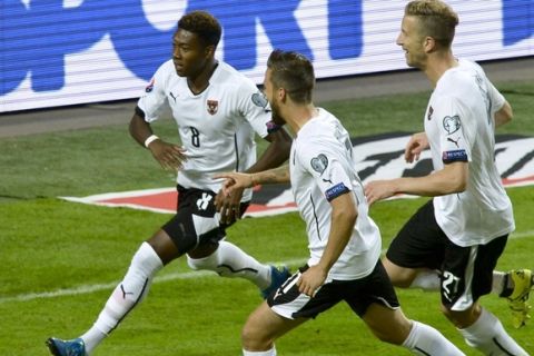 Austria's David Alaba (L) celebrates scoring a penalty with his team-mates Martin Harnik (C) and Marc Janko (R) during the Euro 2016 qualifying group G football match between Sweden and Austria at the Friends Arena in Solna, near Stockholm on September 8, 2015. AFP PHOTO / TT NEWS AGENCY  JONAS EKSTROMER    +++ SWEDEN OUT +++        (Photo credit should read JONAS EKSTROMER/AFP/Getty Images)