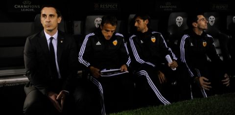 VALENCIA, SPAIN - DECEMBER 09:  Gary Neville (L) manager of Valencia and Phil Neville assistant manager of Valencia (2L) look on from the bench prior to the UEFA Champions League Group H match between Valencia CF and Olympique Lyonnais at Estadio Mestalla on December 9, 2015 in Valencia, Spain.  (Photo by Alex Caparros/Getty Images)