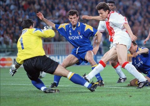 Jari Litmanen of Ajax (right), puts the ball past Juventus goalkeeper Angelo Peruzzi, to score for his team, during the soccer Champions Cup final at Rome's Olympic stadium Wednesday May 22, 1996. Other players are unidentified(AP Photo/Dusan Vranic)