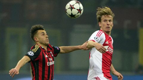 AC Milan's forward Stephan  El Shaarawy (R) fights for the ball with Ajax's Danish midfielder Christian Poulsen during the group H Champions League football match AC Milan vs Ajax,  on December 11, 2013 in San Siro Stadium..AFP PHOTO / OLIVIER MORIN        (Photo credit should read OLIVIER MORIN/AFP/Getty Images)