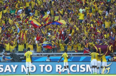 BELO HORIZONTE, BRAZIL - JUNE 14: Colombia celebrate the teams third goal scored by James Rodriguez (obscured) during the 2014 FIFA World Cup Brazil Group C match between Colombia and Greece at Estadio Mineirao on June 14, 2014 in Belo Horizonte, Brazil.  (Photo by Jeff Gross/Getty Images)