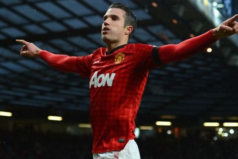 MANCHESTER, ENGLAND - FEBRUARY 10:  Robin van Persie of Manchester United celebrates scoring his team's second goal during the Barclays Premier League match between Manchester United and Everton at Old Trafford on February 10, 2013 in Manchester, England.  (Photo by Shaun Botterill/Getty Images)