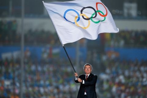 NANJING, CHINA - AUGUST 28: International Olympic Committee (IOC) President Thomas Bach waves the Olympic flag during the Closing Ceremony of Nanjing 2014 Summer Youth Olympic Games at the Nanjing Olympic Sports Centre on August 28, 2014 in Nanjing, China.  (Photo by Lintao Zhang/Getty Images)