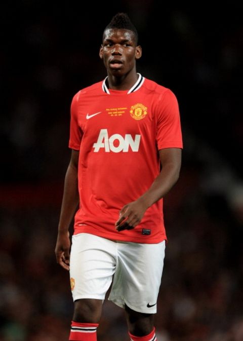 MANCHESTER, ENGLAND - AUGUST 05:  Paul Pogba of Manchester United looks on during Paul Scholes' Testimonial Match between Manchester United and New York Cosmos at Old Trafford on August 5, 2011 in Manchester, England.  (Photo by Chris Brunskill/Getty Images)