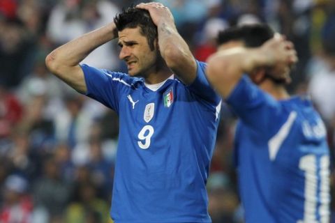 Italy's Vincenzo Iaquinta, left, and Alberto Gilardino react during the World Cup group F soccer match between Slovakia and Italy at Ellis Park Stadium in Johannesburg, South Africa, Thursday, June 24, 2010.  (AP Photo/Bernat Armangue)