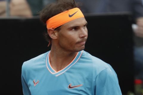 Rafael Nadal of Spain reacts during his match with Stefanos Tsitsipas of Greece during a semifinal match at the Italian Open tennis tournament, in Rome, Saturday, May 18, 2019. (AP Photo/Andrew Medichini)