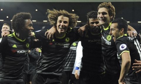 Chelsea's players celebrate after the English Premier League soccer match between West Bromwich Albion and Chelsea, at the Hawthorns in West Bromwich, England, Friday, May 12, 2017. Chelsea won the match 0-1 meaning they win the Premiership title. (AP Photo/Rui Vieira)