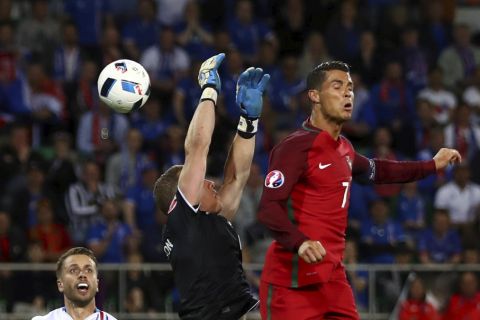 Cristiano Ronaldo of Portugal and Hannes Halldórsson of Iceland during their UEFA Euro 2016 Group F match