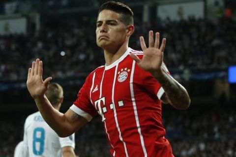 Bayern's James celebrates after scoring his side's second goal during the Champions League semifinal second leg soccer match between Real Madrid and FC Bayern Munich at the Santiago Bernabeu stadium in Madrid, Spain, Tuesday, May 1, 2018. (AP Photo/Paul White)
