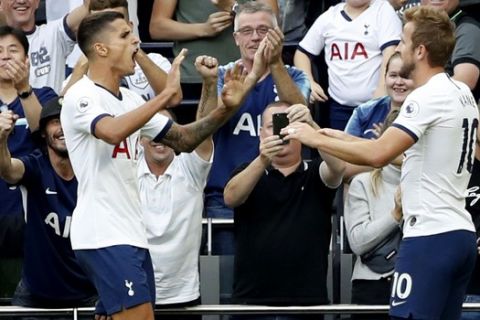 Tottenham's Erik Lamela, left, celebrates with Tottenham's Harry Kane after scoring his side's fourth goal during their English Premier League soccer match between Tottenham Hotspur and Crystal Palace at White Hart Lane stadium in London, Saturday, Sept. 14, 2019. (AP Photo/Alastair Grant)