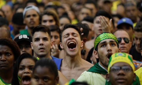 Brazil soccer fans watch a live broadcast of the Russia World Cup quarterfinal match between Brazil and Belgium, in Rio de Janeiro, Brazil, Friday, July 6, 2018. (AP Photo/Leo Correa)