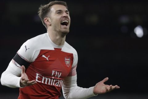 Arsenal's Aaron Ramsey celebrates after scoring his side's third goal during the English Premier League soccer match between Arsenal and Fulham at Emirates stadium in London, Tuesday, Jan. 1, 2019. (AP Photo/Kirsty Wigglesworth)
