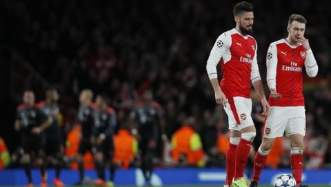 Arsenal's Olivier Giroud, left, and his teammate Aaron Ramsey stand after Bayern Munich scores during the Champions League round of 16 second leg soccer match between Arsenal and Bayern Munich at the Emirates Stadimum in London, Tuesday, March 7, 2017. (AP Photo/Kirsty Wigglesworth)