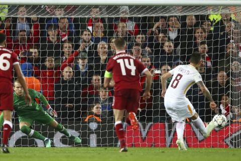 Roma's Diego Perotti, right, scores his side's second goal from the penalty spot during the Champions League semifinal, first leg, soccer match between Liverpool and AS Roma at Anfield Stadium, Liverpool, England, Tuesday, April 24, 2018. (AP Photo/Dave Thompson)