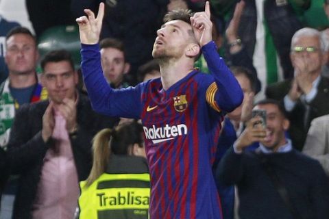 Barcelona's Messi celebrates after scoring during La Liga soccer match between Betis and Barcelona at the Benito Villamarin stadium in Seville, Spain, Sunday, March 17, 2019. (AP Photo/Miguel Morenatti)