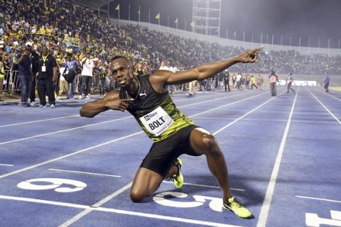 Jamaica's Usain Bolt celebrates after winning the "Salute to a Legend " 100 meters during the Racers Grand Prix at the national stadium in Kingston, Jamaica, Saturday, June 10, 2017. Bolt started his final season with his last race on Jamaican soil and plans to retire from track and field after the 2017 London World Championships in August. (AP Photo/Bryan Cummings)