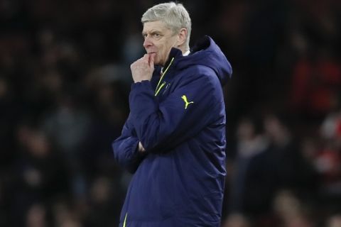 Arsenal manager Arsene Wenger gestures during the Champions League round of 16 second leg soccer match between Arsenal and Bayern Munich at the Emirates Stadimum in London, Tuesday, March 7, 2017. (AP Photo/Kirsty Wigglesworth)
