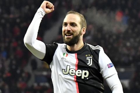Juventus' Gonzalo Higuain celebrates after scoring his side's second goal during the Champions League Group D soccer match between Bayer Leverkusen and Juventus at the BayArena in Leverkusen, Germany, Wednesday, Dec. 11, 2019. (AP Photo/Martin Meissner)
