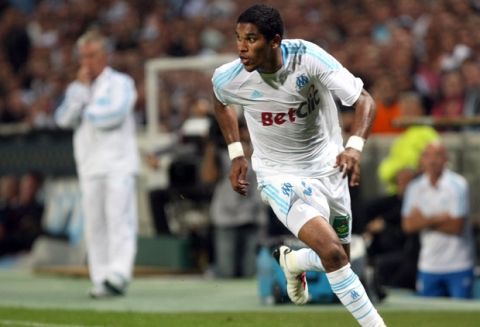Marseille's Brazilian forward Evaeverson Lemos Brandao, during their French League One soccer match against Monaco, in Marseille, southern France, Sunday, Sept. 12, 2010. Behind Marseille's French coach Didier Deschamps is seen. (AP Photo/Claude Paris)
