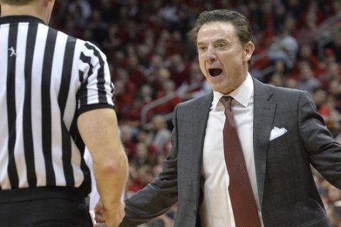 Louisville's head coach Rick Pitino argues a call with a game official during the first half of an NCAA college basketball game against Notre Dame, Saturday, March 4, 2017, in Louisville, Ky. (AP Photo/Timothy D. Easley)
