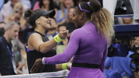 Bianca Andreescu, of Canada, left, greets Serena Williams, of the United States, after winning the women's singles final of the U.S. Open tennis championships Saturday, Sept. 7, 2019, in New York. (AP Photo/Charles Krupa)