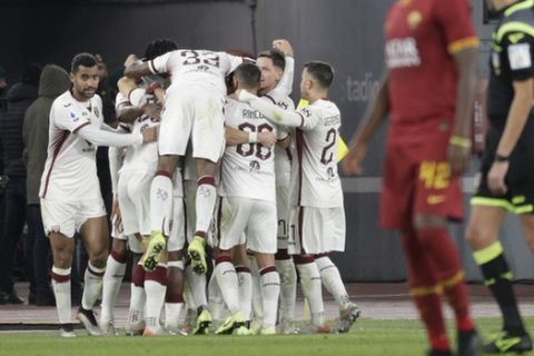 Torino players celebrate after Torino's Andrea Belotti scored his side's second goal during the Serie A soccer match between Roma and Torino at the Rome Olympic Stadium, Italy, Sunday, Jan. 5, 2020. (AP Photo/Andrew Medichini)