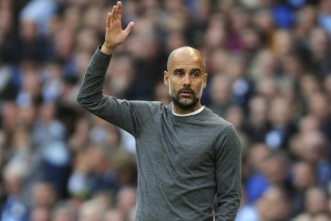 Manchester City manager Josep Guardiola reacts during the English Premier League soccer match between Manchester City and Burnley at Etihad stadium in Manchester, England, Saturday, Oct. 20, 2018. (AP Photo/Rui Vieira)