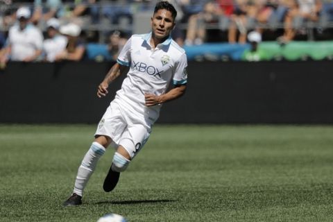 Seattle Sounders forward Raul Ruidiaz moves on the ball during an MLS soccer match against the Vancouver Whitecaps, Saturday, July 21, 2018, in Seattle. (AP Photo/Ted S. Warren)