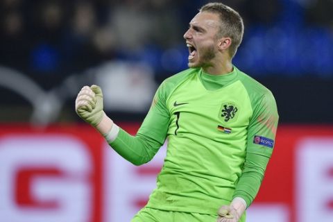 Netherland's keeper Jasper Cillessen celebrates after his teammate Virgil Van Dijk scored his side's second goal in the 90th minute during the UEFA Nations League soccer match between Germany and The Netherlands in Gelsenkirchen, Monday, Nov. 19, 2018. The match ended 2-2. (AP Photo/Martin Meissner)