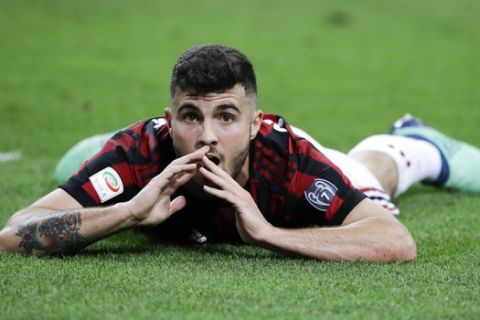 AC Milan's Patrick Cutrone lies on the ground after he failed a scoring chance during a Serie A soccer match between AC Milan and Benevento, at the San Siro stadium in Milan, Italy, Saturday, April 21, 2018. (AP Photo/Luca Bruno)