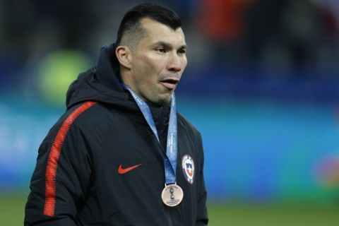 Chile's Gary Medel looks on with his fourth place medal hanging of his neck at the end of the Copa America third-place soccer match at the Arena Corinthians in Sao Paulo, Brazil, Saturday, July 6, 2019. Chile lost 1-2 against Argentina.(AP Photo/Victor R. Caivano)
