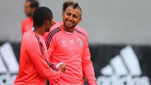 "MUNICH, GERMANY - MAY 02:  Douglas Costa (L) and Arturo Vidal shake hands during a FC Bayern Muenchen training session ahead of their UEFA Champions League semi final second leg match against Club Atletico de Madrid at the Saebener Strasse training ground on May 2, 2016 in Munich, Germany.  (Photo by Alexander Hassenstein/Bongarts/Getty Images)"