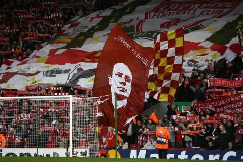 LIVERPOOL, UNITED KINGDOM - APRIL 08:  Supporters on the Kop show off their flags and scarves prior to the UEFA Champions League Quarter Final, second leg match between Liverpool and Arsenal at Anfield on April 8, 2008 in Liverpool, England.  (Photo by Clive Brunskill/Getty Images)