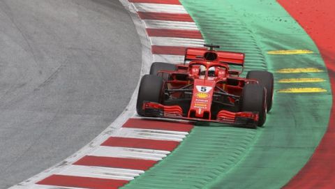 Ferrari driver Sebastian Vettel of Germany takes a curve during the qualifying session for the Austrian Formula One Grand Prix at the Red Bull Ring racetrack in Spielberg, southern Austria, Saturday June 30, 2018. The race will be held on Sunday. (AP Photo/Ronald Zak)