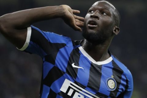FILE - In this Saturday, Sept.21, 2019 file photo, Inter Milan's Romelu Lukaku celebrates after scoring during a Serie A soccer match between AC Milan and Inter Milan, at the San Siro stadium in Milan, Italy. The Italian soccer federation is considering employing an advanced listening device used in anti-terrorism operations to identify fans who sing racist chants. Federation president Gabriele Gravina has detailed "a passive radar device that uses directional microphones to determine the source of the noise." (AP Photo/Luca Bruno, File)
