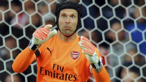 Arsenal's Petr Cech saves a shot during the English Premier League soccer match between Stoke City and Arsenal at the Bet365 Stadium in Stoke on Trent, England, Saturday, Aug. 19, 2017. (AP Photo/Rui Vieira)