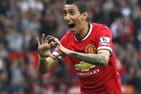 Manchester United's Angel Di Maria celebrates after scoring a goal against Queens Park Rangers during their English Premier League soccer match at Old Trafford in Manchester, northern England September 14, 2014.  REUTERS/Andrew Yates   (BRITAIN - Tags: SPORT SOCCER TPX IMAGES OF THE DAY) NO USE WITH UNAUTHORIZED AUDIO, VIDEO, DATA, FIXTURE LISTS, CLUB/LEAGUE LOGOS OR "LIVE" SERVICES. ONLINE IN-MATCH USE LIMITED TO 45 IMAGES, NO VIDEO EMULATION. NO USE IN BETTING, GAMES OR SINGLE CLUB/LEAGUE/PLAYER PUBLICATIONS. FOR EDITORIAL USE ONLY. NOT FOR SALE FOR MARKETING OR ADVERTISING CAMPAIGNS