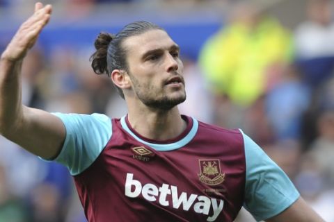 FILE - This is a Sunday, April 17, 2016  file photo of  West Ham United's Andy Carroll as he celebrates after scoring his sides first goal from the penalty spot during the English Premier League soccer match between Leicester City and West Ham United at the King Power Stadium in Leicester. West Ham manager Slaven Bilic said Thursday Nov. 3, 2016,  Andy Carroll was targeted by armed motorcyclists as the striker left the Premier League club's training ground. Carroll told West Ham he was confronted at a junction on Wednesday. (AP Photo/Rui Vieira, File)
