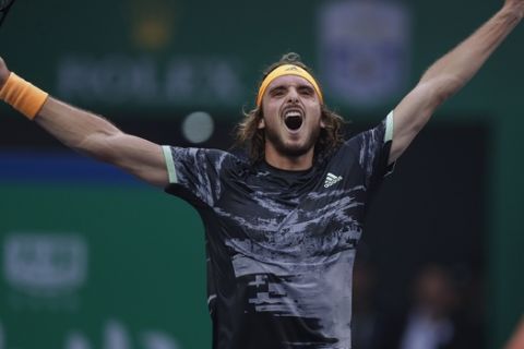 Stefanos Tsitsipas of Greece celebrates after defeating Novak Djokovic of Serbia in the men's singles quarterfinals match at the Shanghai Masters tennis tournament at Qizhong Forest Sports City Tennis Center in Shanghai, China, Friday, Oct. 11, 2019. (AP Photo/Andy Wong)