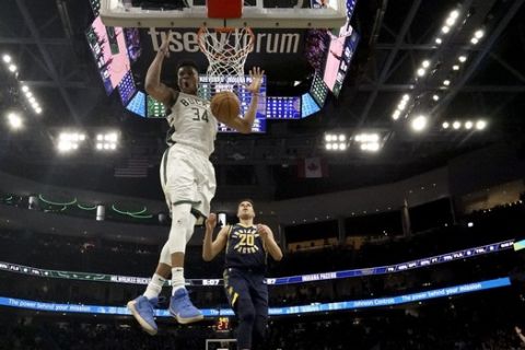 Milwaukee Bucks' Giannis Antetokounmpo dunks during the second half of an NBA basketball game against the Indiana Pacers Wednesday, March 4, 2020, in Milwaukee. The Bucks won 119-100. (AP Photo/Morry Gash)