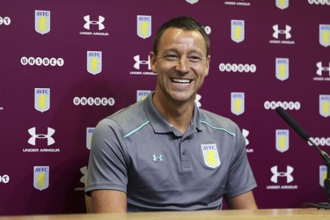 New Aston Villa signing John Terry, reacts during the media conference at Villa Park, Birmingham, England, Monday July 3, 2017.  Former England and Chelsea captain John Terry has signed a one-year deal with second-division Aston Villa, saying he is "delighted" and is looking to "help the squad achieve something special this season."(Aaron Chown/PA via AP)