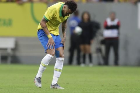 Brazil's Neymar picks himself up after being fouled during a friendly soccer match against Qatar at the Estadio Nacional in Brasilia, Brazil, Wednesday, June 5, 2019.(AP Photo/Andre Penner)