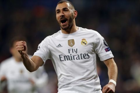 FILE - In this Tuesday, Dec. 8, 2015 file photo, Real Madrid's Karim Benzema celebrates scoring the opening goal during a Champions League group A soccer match between Real Madrid and Malmo at the Santiago Bernabeu stadium in Madrid. French Football Federation president Noel Le Graet on Wednesday, June 22, 2016 has opened the door for striker Karim Benzema's return after the European Championship. The Real Madrid forward is facing preliminary charges of conspiracy to blackmail in a sex-tape scandal involving France teammate Mathieu Valbuena. (AP Photo/Daniel Ochoa de Olza, file)